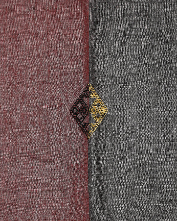 Close detail of the woven diamond motif at the rose-charcoal seam