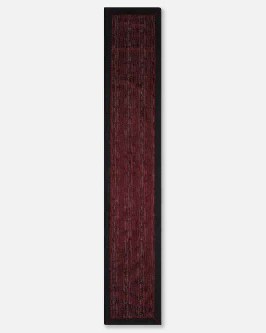 Full length of the Bordeaux-red silk runner with black border