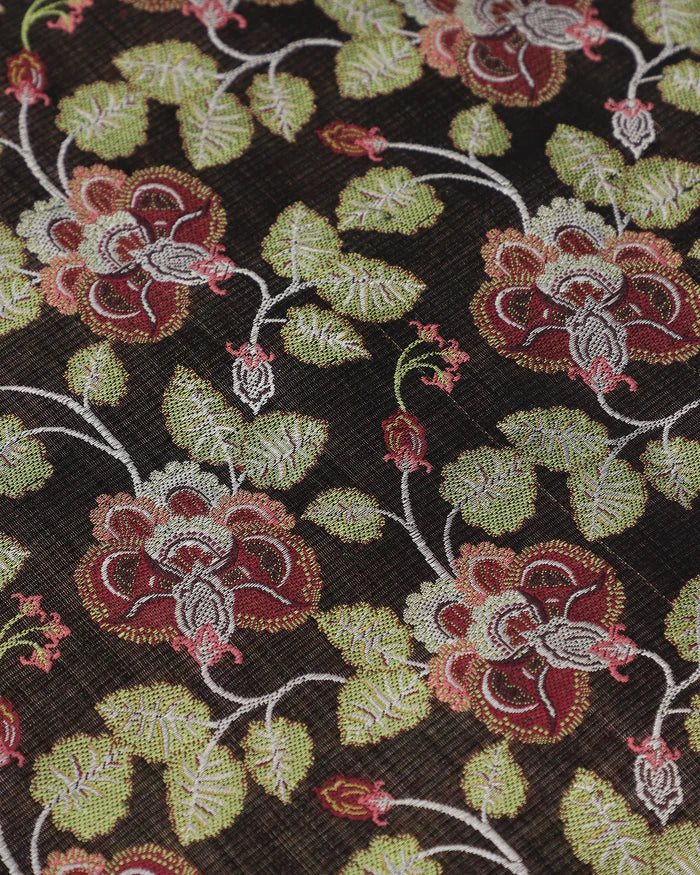 Close detail of green and red climbing florals woven into black silk, not printed