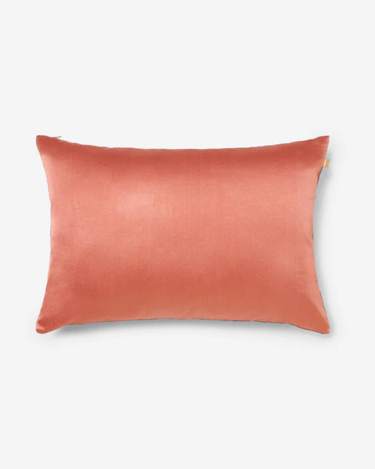 Solid coral silk reverse of the Anār lumbar pillow — back view