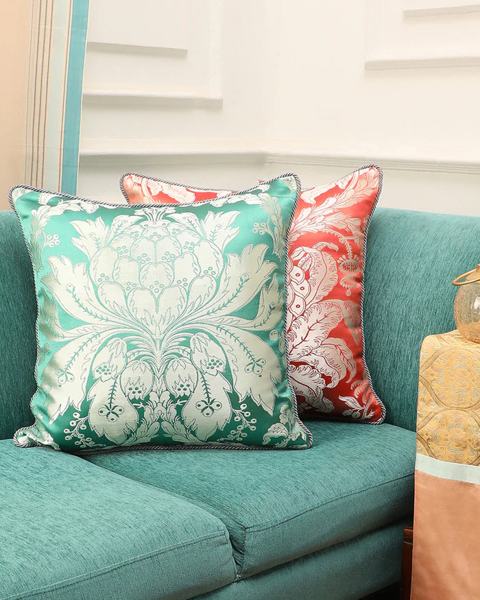 Aqua lotus Gyasar silk pillow styled on a sofa