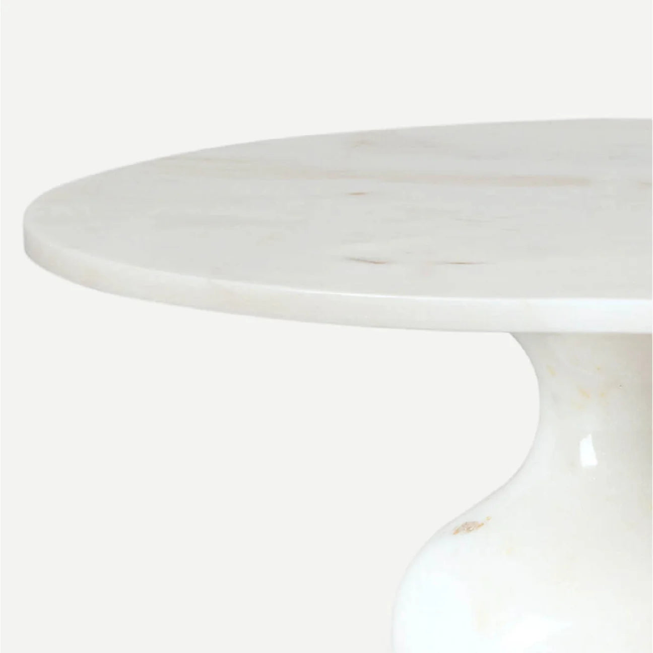 Top serving surface showing the marble's soft natural striations