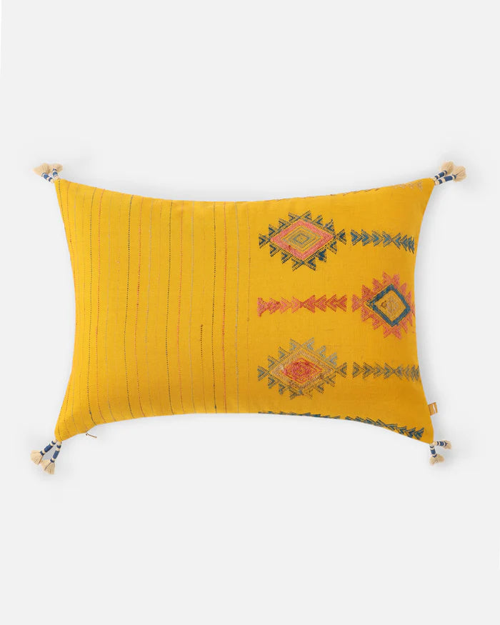 Front — marigold-yellow Bhujodi cotton with woven Aztec-diamond motifs and corner tassels