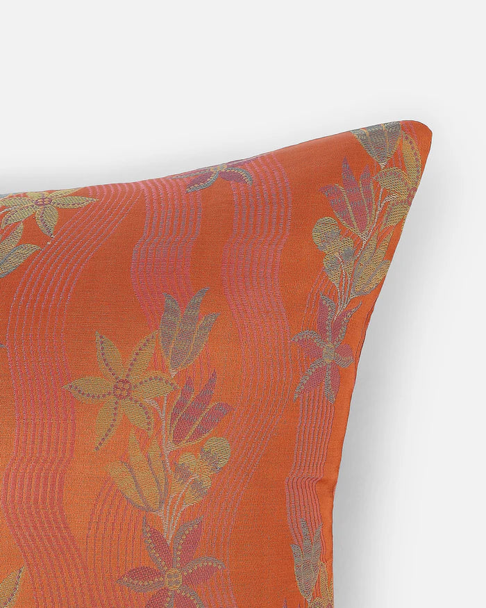 Close-up detail of Tanchoi floral-vines woven into the orange silk, not printed.