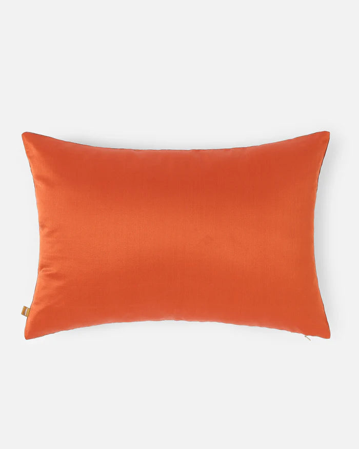 Reverse of lumbar pillow in solid orange silk