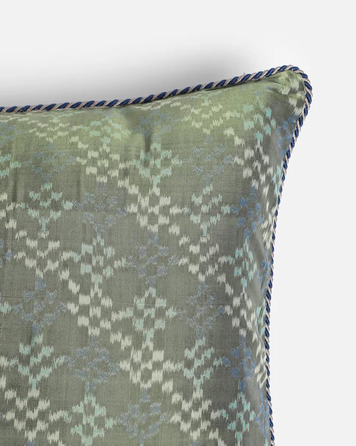 Close detail of the feathered sage green lattice of Pochampally ikat silk pillow