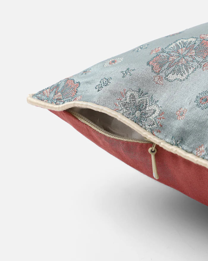 Side view showing powder-blue front, rose reverse and hidden zip