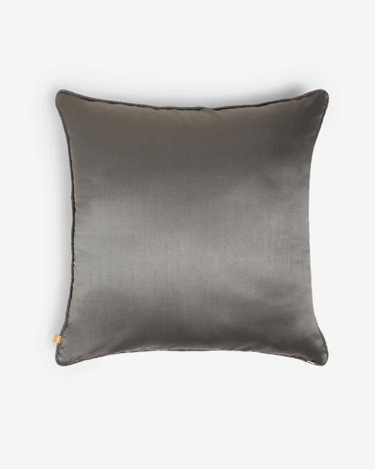 The reverse side of the Ceremonial Scroll pillow showing a smooth, solid plane of luminous grey silk with piping detail.