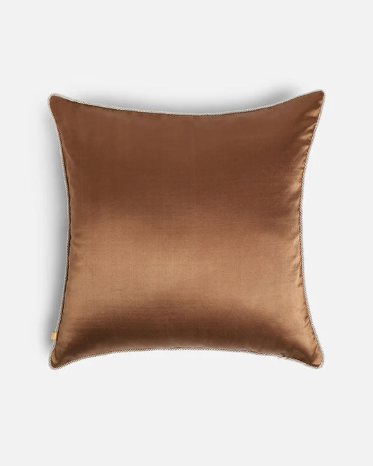 The solid warm bronze silk reverse of the Gilded Emerald pillow, showcasing the dual-sided luxury design.