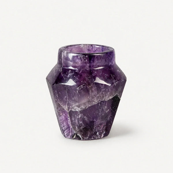 A single shot glass hand-carved from deep-violet natural amethyst crystal