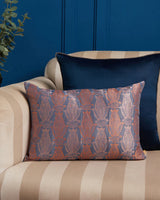 Anār indigo-and-coral silk pillow styled on a sofa — lifestyle view