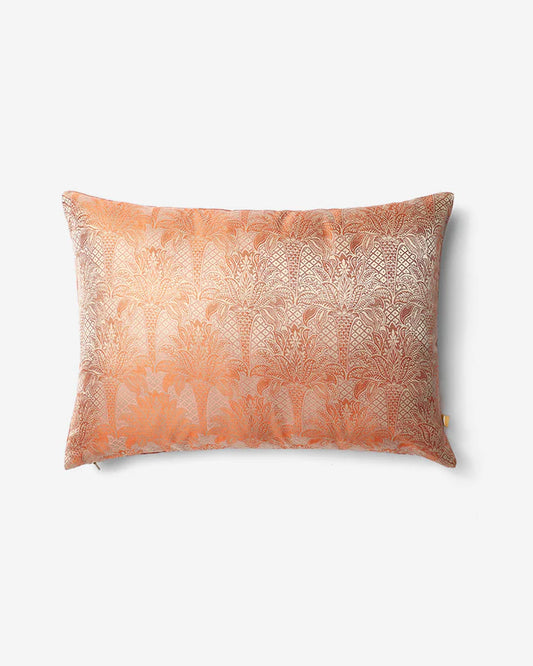 Front view of the Apricot Canopy pillow showing the dense, shimmering palm forest woven into the silk structure.