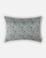 A full studio front view showing the raised texture of the copper Bel vine motifs woven into cool silk.