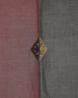 Close detail of the woven diamond motif at the rose-charcoal seam