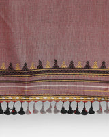 Detail of the woven border and hand-knotted tassel fringe