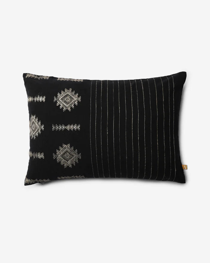 Front — black Bhujodi cotton lumbar pillow with ivory extra-weft diamond motifs and fine stripes