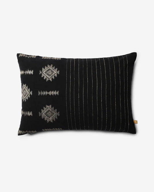 Front — black Bhujodi cotton lumbar pillow with ivory extra-weft diamond motifs and fine stripes