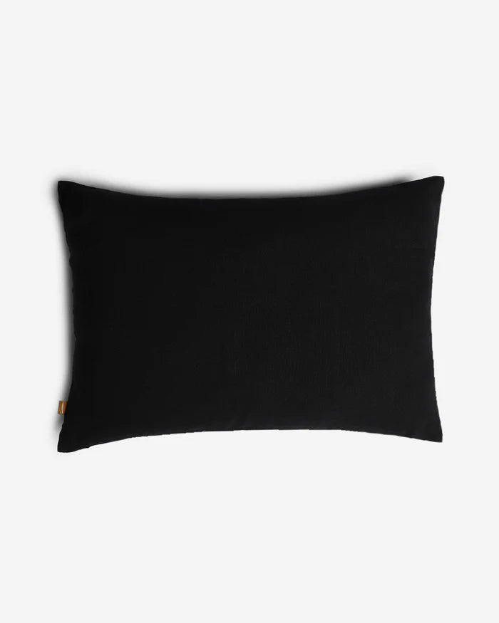 Reverse lumbar pillow in solid black cotton