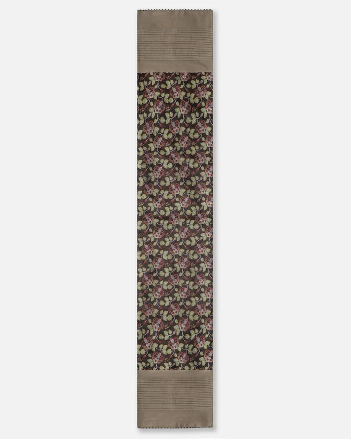 Full length of the black floral Banarasi silk table runner with pintucked border
