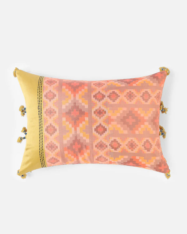 The Bohemian Rhapsody dual-sided silk pillow featuring a sun-warmed apricot and gold Pochampally ikat diamond pattern.