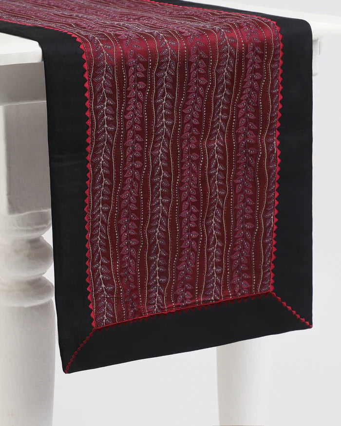 Bordeaux red runner — woven vine stripes in deep red Tanchoi silk, draped on a table