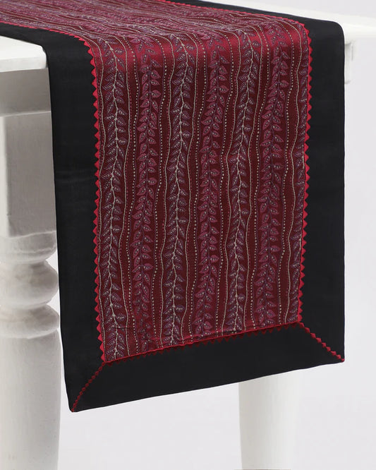Bordeaux red runner — woven vine stripes in deep red Tanchoi silk, draped on a table