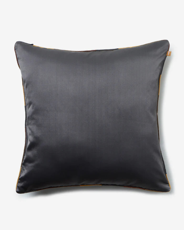 Reverse in solid charcoal silk with silver piping
