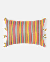 Reverse lumbar pillow in coral with a woven stripe panel