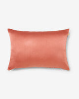 Solid coral silk reverse of the Anār lumbar pillow — back view