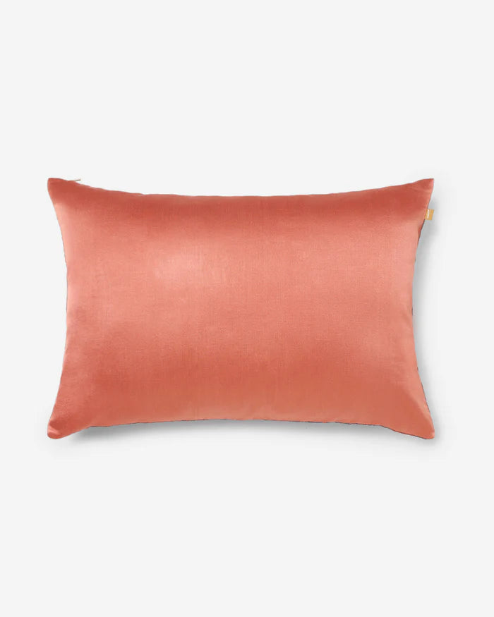 Solid coral silk reverse of the Anār lumbar pillow — back view