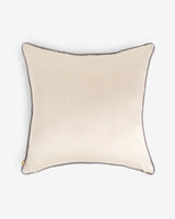 The solid cream silk reverse side of the 20x20 dual-sided Lotus pillow with grey corded piping.