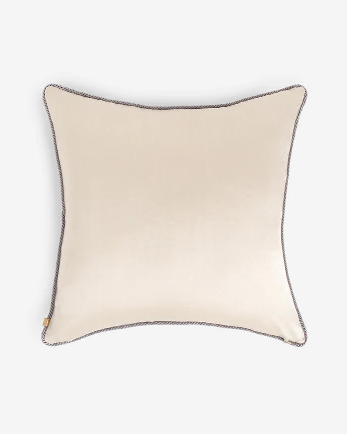 The solid cream silk reverse side of the 20x20 dual-sided Lotus pillow with grey corded piping.