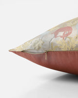 Side view showing ivory silk front, coral reverse and hidden zip