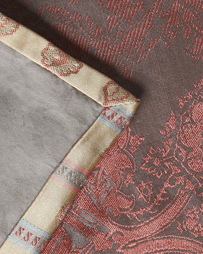 Corner detail of the woven gold-and-cream border on the Tanchoi silk runner