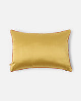 Reverse in warm gold silk with hand-applied piping