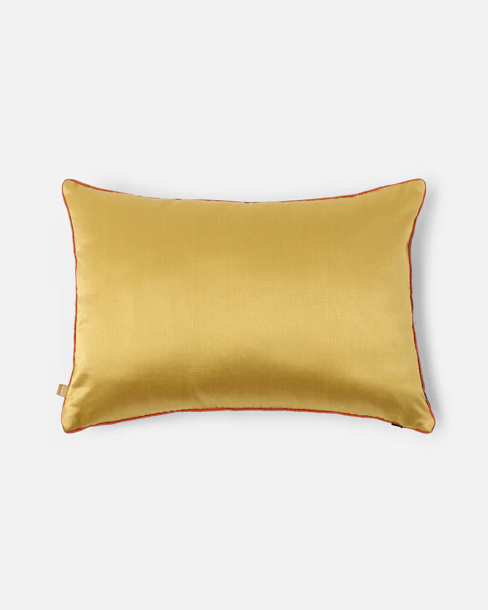 Reverse in warm gold silk with hand-applied piping