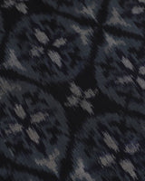 Close detail of woven indigo Pochampally ikat silk table runner, dyed before weaving