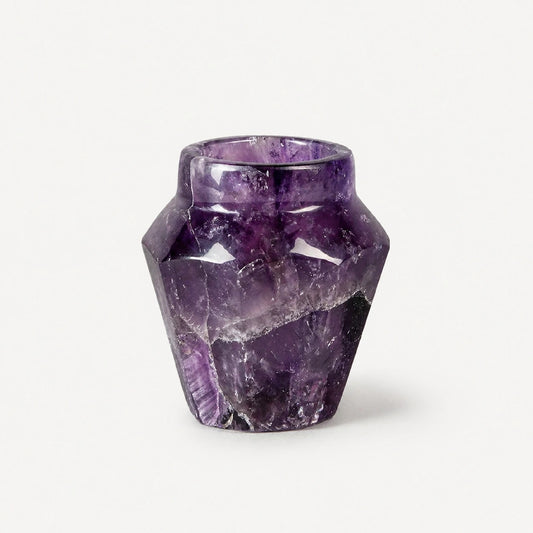 Deep violet amethyst crystal shot glass displayed on a marble surface as a luxury housewarming gift — hand-carved from solid violet quartz, limited edition, by Home & the World.