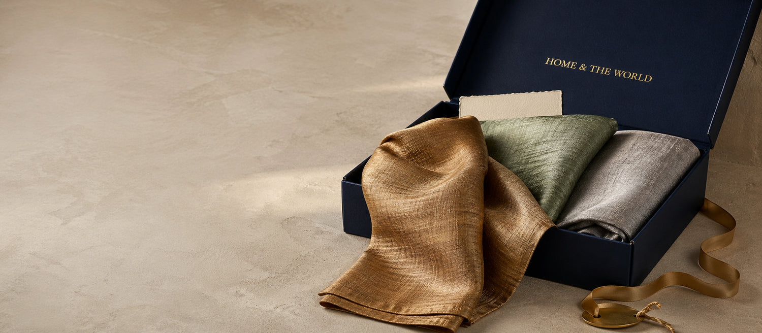 Home & the World signature navy gift box with handwoven silk pieces