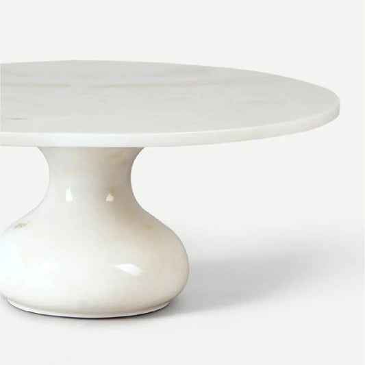 Close-up of the hand-carved edge and natural grey veining of a UNESCO-listed Makrana marble stand from Rajasthan.