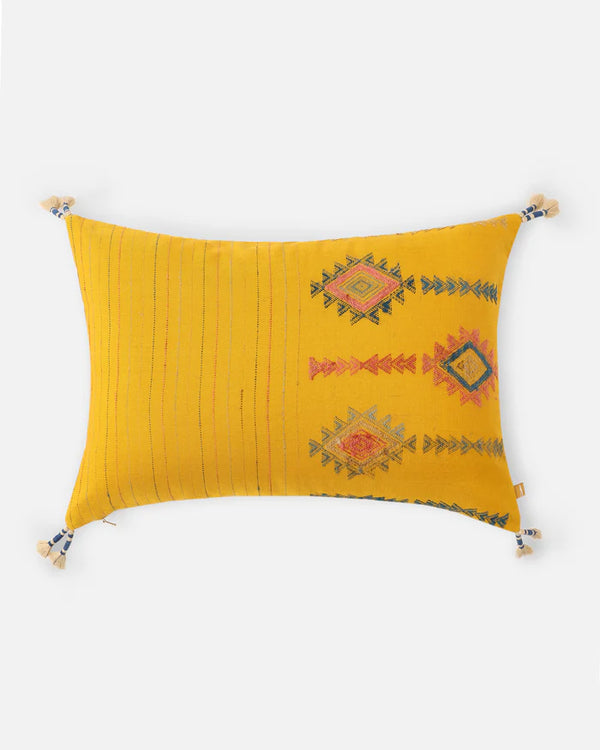 Front — marigold-yellow Bhujodi cotton with woven Aztec-diamond motifs and corner tassels