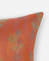 Close-up detail of Tanchoi floral-vines woven into the orange silk, not printed.