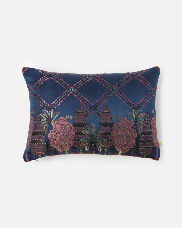 Midnight Garden lumbar pillow front — midnight-blue Gyasar silk with handwoven cypress, palm and lattice motifs in jewel tones