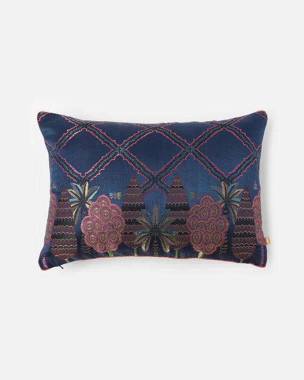 Midnight Garden lumbar pillow front — midnight-blue Gyasar silk with handwoven cypress, palm and lattice motifs in jewel tones