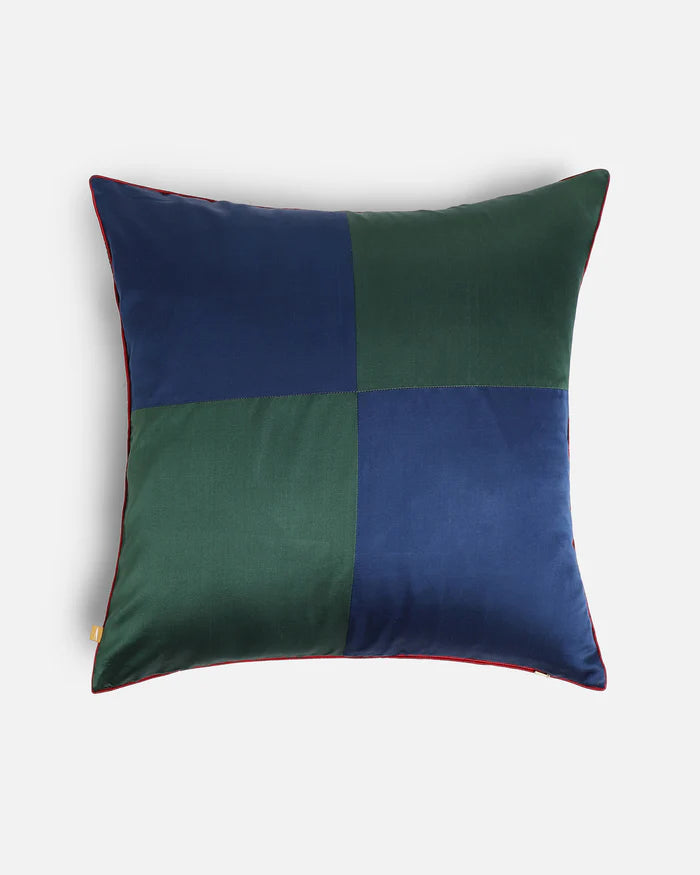 The high-contrast reverse face of the 20x20 dual-sided cushion, showing the navy blue and forest green silk color-blocked quadrant design.