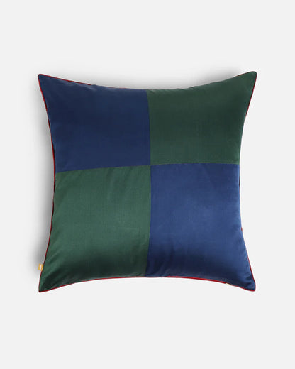 The high-contrast reverse face of the 20x20 dual-sided cushion, showing the navy blue and forest green silk color-blocked quadrant design.