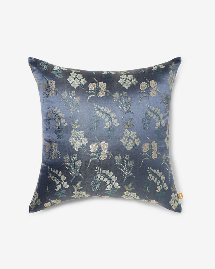 Cream-and-gold botanical sprigs woven into navy silk — front of the Banarasi Botanical pillow