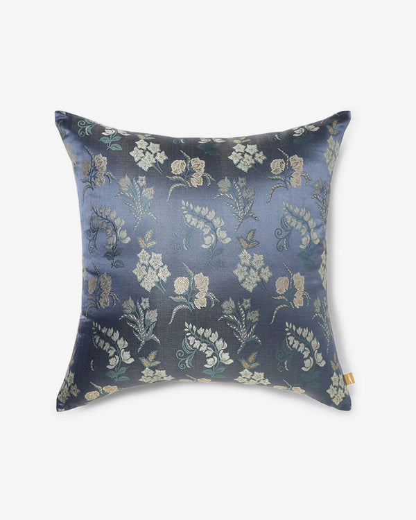 Cream-and-gold botanical sprigs woven into navy silk — front of the Banarasi Botanical pillow