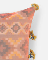 Close-up of the Bohemian Rhapsody front motif, showing the blurred geometric edges of hand-loomed apricot and rose silk threads.