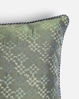 Close detail of the feathered sage green lattice of Pochampally ikat silk pillow